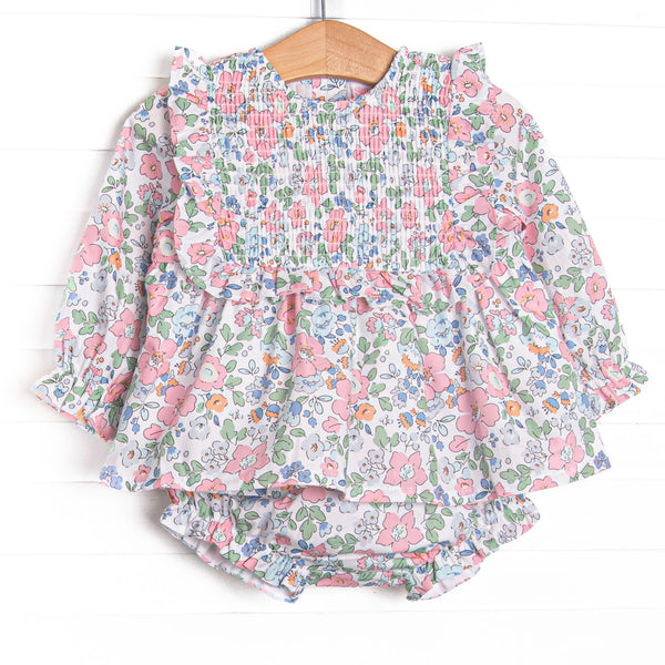 This set features a long sleeve top in a pink floral print with pink ruffles and long sleeves. Coordinating floral diaper cover to match.
