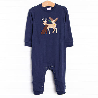 This romper features the softest navy blue knit material, snaps on the stride, and a deer, dog, and duck applique.