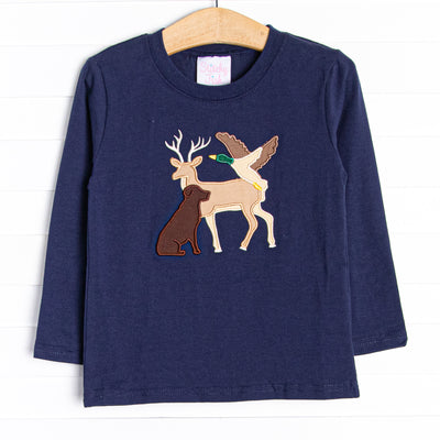 This top features long sleeves, the softest navy blue knit material, sand a deer, dog, and duck applique.