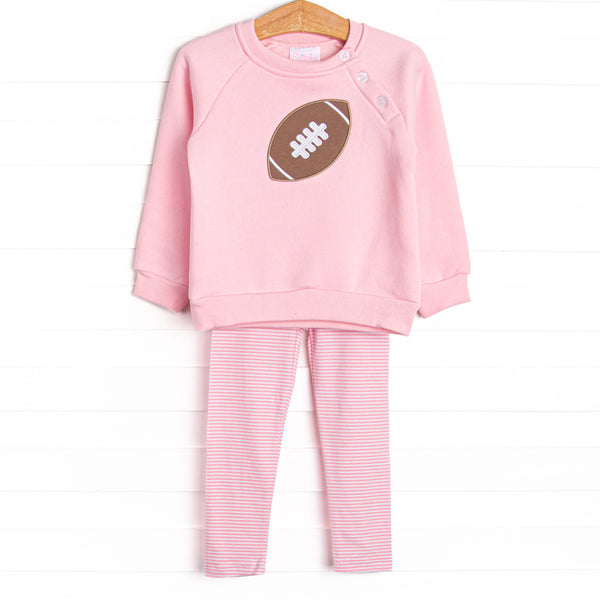 This set features a pink sweatshirt with a football applique, button details, and pink striped leggings to match.
