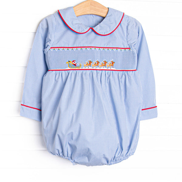  This bubble features a blue gingham print, peter pan collar, and a santa sleigh smocking.