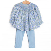  This set features a blue floral print, a dainty smocking, and blue leggings to match. 