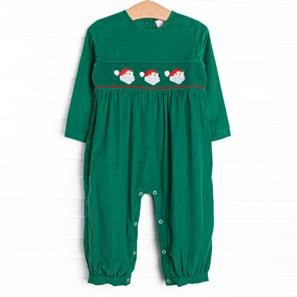 This romper features a green corduroy material, snaps on the stride, and Santa Claus smockings.