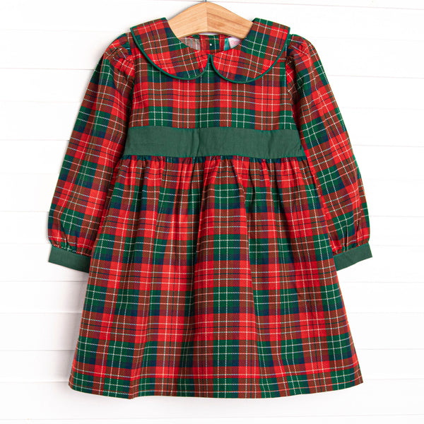  This dress features a red plaid print, a green sash, and a peter pan collar. 