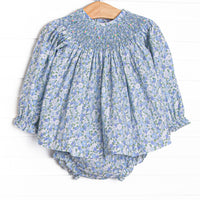 This set features a blue floral print, a dainty smocking, and blue diaper cover to match.