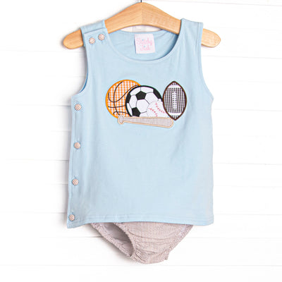 This set features a blue knit top with&nbsp;a variety of sports ball appliques and tan seersucker diaper cover to match.