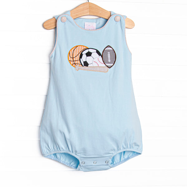 This bubble features blue knit material, snaps on the stride, and a variety of sports ball appliques.