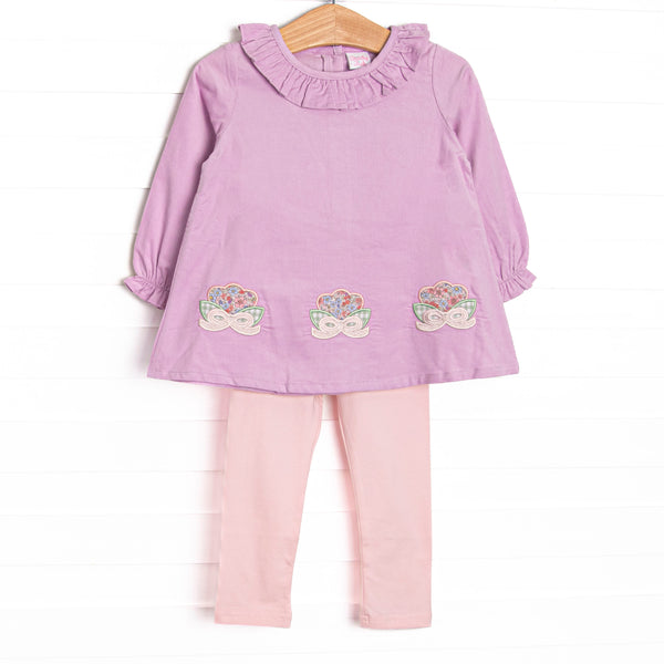 This set features purple corduroy fabric, floral appliques, and a ruffle neck. Coordinating light pink leggings to match.