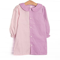 This dress features light pink corduroy fabric on the left, light purple corduroy fabric on the right, pink fabric covered front buttons, and a purple Peter Pan collar. 
