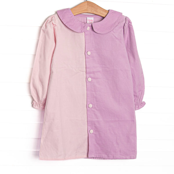  This dress features light pink corduroy fabric on the left, light purple corduroy fabric on the right, pink fabric covered front buttons, and a purple Peter Pan collar. 