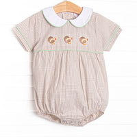  This bubble features tan gingham material, a turkey embroidered design, and a fun trimmed collar. 