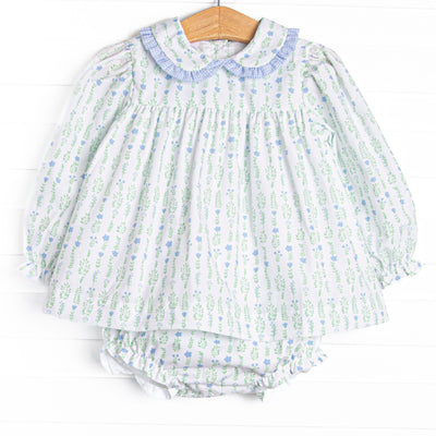 This set features a floral print, a peter pan collar with blue ruffle trim, and matching diaper cover.