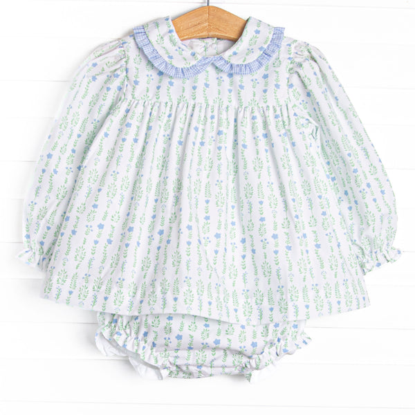 This set features a floral print, a peter pan collar with blue ruffle trim, and matching diaper cover.