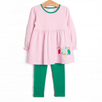 This set features a pink striped print, green trim, and Christmas light appliques. Coordinating green leggings to match.