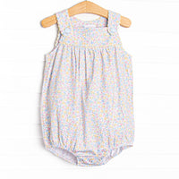 This bubble features a yellow floral print, front buttons, and snaps on the stride.