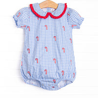  This bubble features a blue gingham print, puff sleeves, and candy cane embroideries. 
