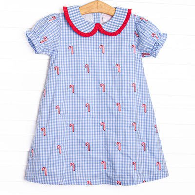  This dress features a blue gingham print, puff sleeves, and candy cane embroideries. 