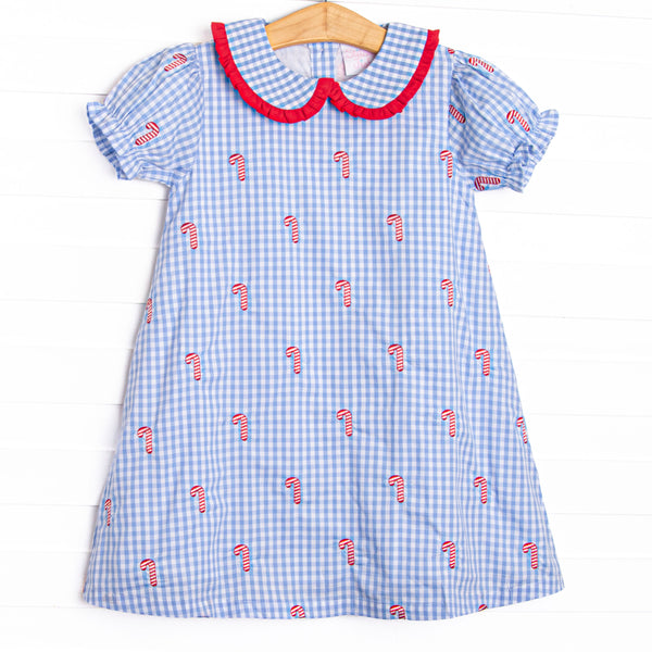  This dress features a blue gingham print, puff sleeves, and candy cane embroideries. 
