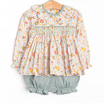 This set features green floral fabric, chest smocking, and a scalloped collar. Coordinating green bloomer shorts to match.