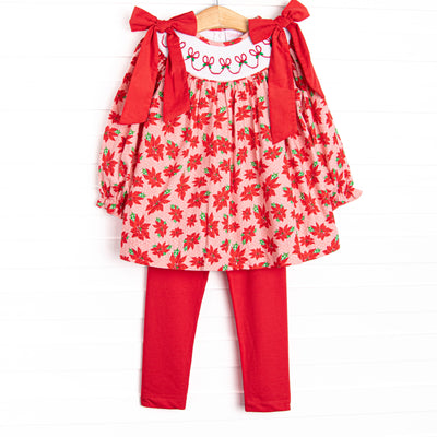 This set features a poinsettia print, holly smocking, and big red corduroy bows on the shoulders.