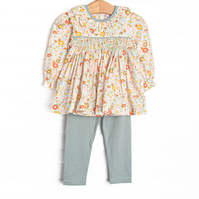 This set features green floral fabric, chest smocking, and a scalloped collar. Coordinating green leggings to match.