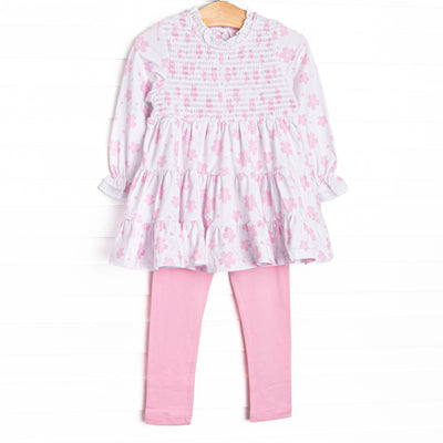  This set features pink floral print, chest smocking, and eyelet lace trim. Coordinating pink leggings to match. 