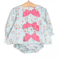 This set features green floral print, pink front bows, and long sleeves. Coordinating diaper cover to match.