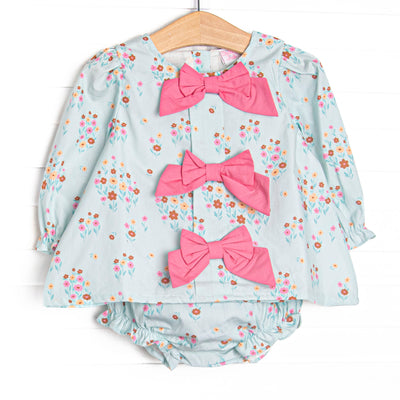 This set features green floral print, pink front bows, and long sleeves. Coordinating diaper cover to match.