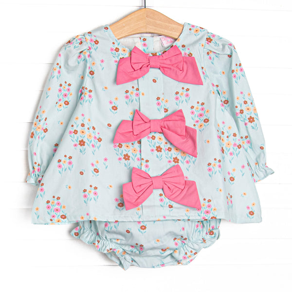 This set features green floral print, pink front bows, and long sleeves. Coordinating diaper cover to match.