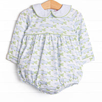 This bubble features a fish print, a peter pan collar, and snaps on the stride.