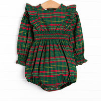 This bubble features a green plaid print, ruffle trim, and elastic smocking.