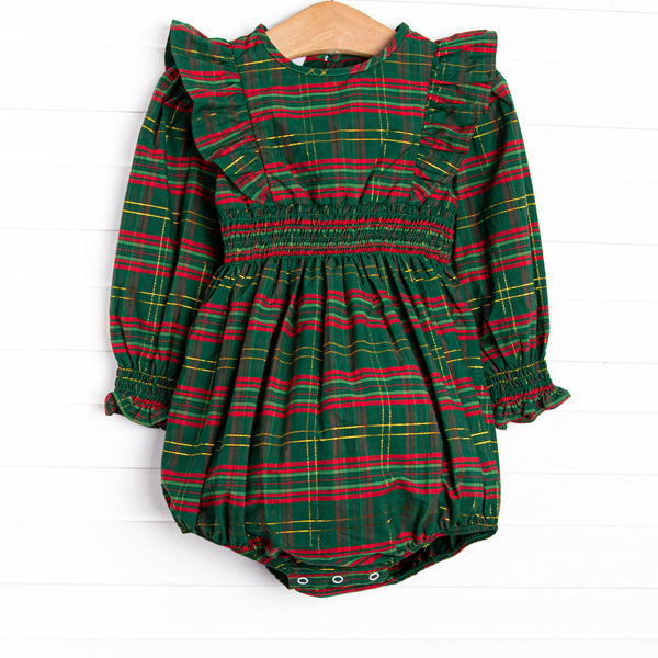 This bubble features a green plaid print, ruffle trim, and elastic smocking.