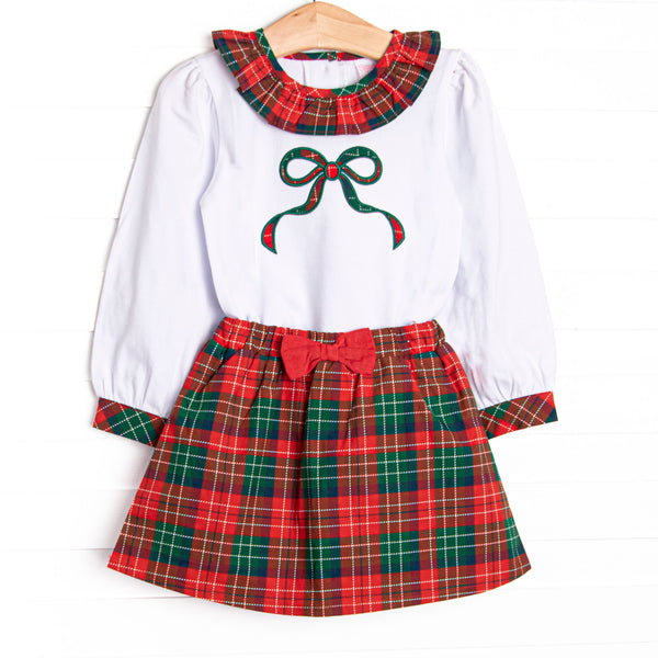 This set features a long sleeve top with green bow applique, and a ruffle collar. Coordinating red plaid skirt with a darling red bow detail to match.