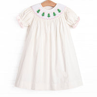  This dress features a white corduroy material, puff sleeves, and Christmas tree smockings. 