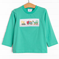  This top features long sleeves, the softest knit material, and a construction themed smocking. 