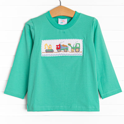  This top features long sleeves, the softest knit material, and a construction themed smocking. 