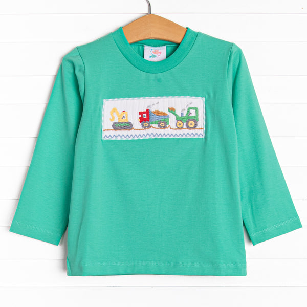  This top features long sleeves, the softest knit material, and a construction themed smocking. 