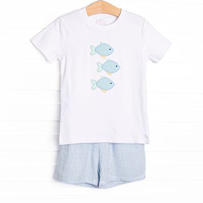 This set features a short sleeve top with a trio of fish appliques and a blue striped shorts to match.