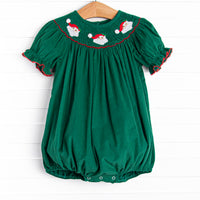 This bubble features a green corduroy material, puff sleeves with red picot trim, and Santa Claus smockings