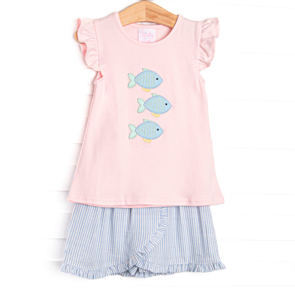 This set features a pink flutter sleeve top with a trio of fish appliques and a blue striped skort to match