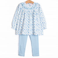  A long sleeve knit top in a blue floral print with a blue ruffle collar. Coordinating blue leggings to match. 