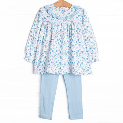  A long sleeve knit top in a blue floral print with a blue ruffle collar. Coordinating blue leggings to match. 