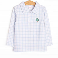 This top features a blue windowpane print, a polo collar, and a Christmas tree applique.