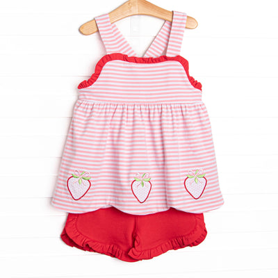 This set features a pink striped print, red ruffle trim, and a trio of strawberries appliques. Coordinating red ruffle shorts to match.