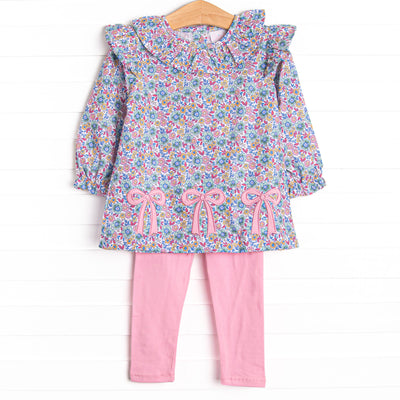 This set features a purple floral print top with a ruffle collar and a trio of bows appliques. Coordinating pink leggings to match.