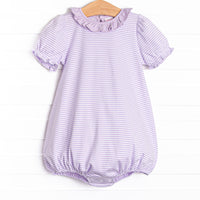 The Elena Pima Bubble features a purple striped print, ruffle collar, and our extremely soft pima cotton material.