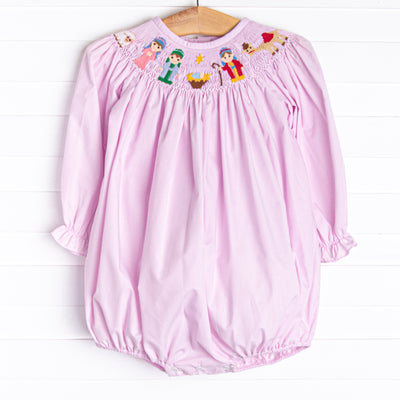  The bubble featured in pink gingham boasts adorable long puff sleeves, snaps in the stride to make changing a breeze, and a smocked Christmas scene. 