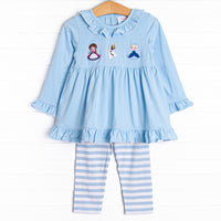 This legging set features long ruffle sleeves, coordinating leggings with blue stripes, and the sweetest princess sisters applique.