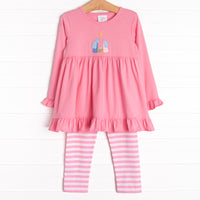 This set features a pink ruffle top with a nativity scene applique and pink striped leggings to match.