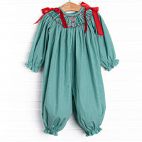  This romper features a green gingham print, red satin bows in the shoulders and candy cane smockings. 